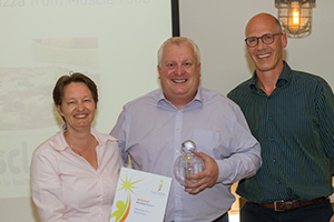 2016 Winner Best New Product - Muscle Food (caption left to right: Colinda Hoegee, MD, Holland & Barrett Benelux, presents Eddie O'Gorman, Muscle Food with Best New Product Award with Gerard Klein Essink, director, Bridge2Food)