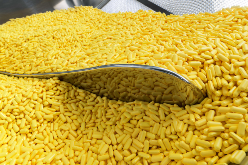 Robust film coating scale-up for vitamins as a case study for nutraceuticals